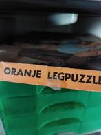 Te koop oranje puzzel en oranje plastic, Ophalen of Verzenden