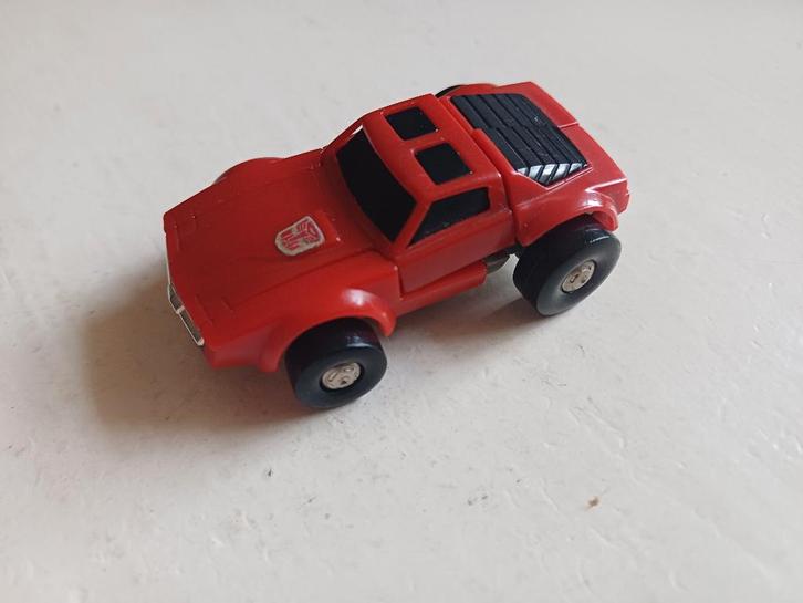 Een vintage rode transformer auto., Verzamelen, Transformers, Gebruikt, G1, Autobots, Ophalen of Verzenden