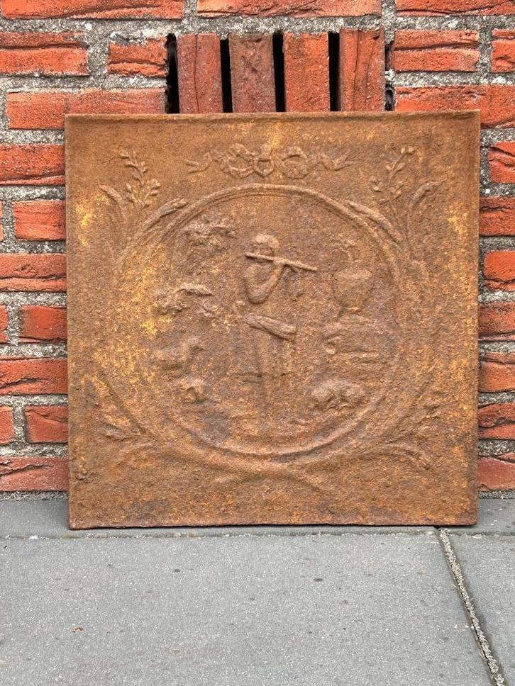 Haardplaat " De Fluitspeler " klein model, Antiek en Kunst, Curiosa en Brocante, Ophalen