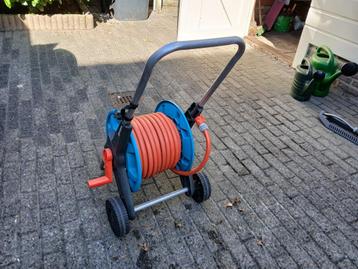 Tuinslang met haspel beschikbaar voor biedingen