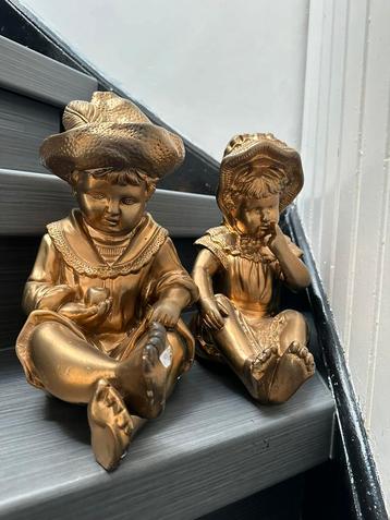 Goud broer en zus beelden beschikbaar voor biedingen
