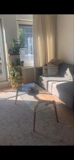 Glazen salontafel met bruine houten poten, Huis en Inrichting, Tafels | Salontafels, Gebruikt, 100 tot 150 cm, Minder dan 50 cm