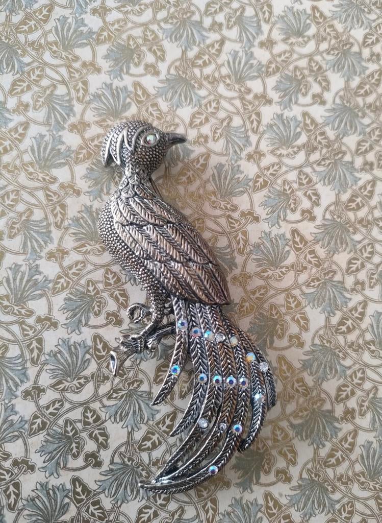 Vintage jaren '80 verzilverde metalen paradijs vogel broche., Overige materialen, Gebruikt, Ophalen of Verzenden, Zilver