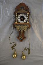 Antieke staartklok met figuur, Ophalen