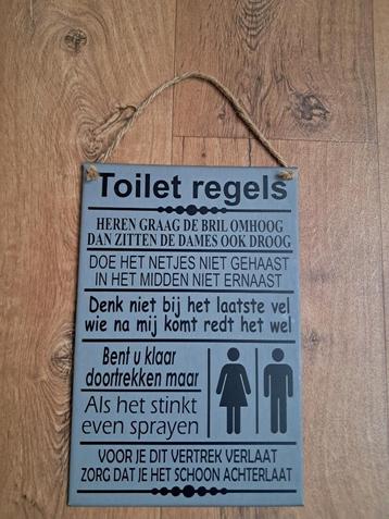 Tekstbord toiletregels (zo komt niemand meer van het toilet) beschikbaar voor biedingen