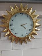 Mooie grote wandklok  in de vorm van een zon., Ophalen of Verzenden, Gebruikt, Analoog, Wandklok