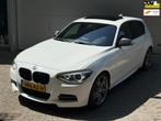 BMW 1-serie M135i xDrive High Executive l Schuifdak l Volled, Gebruikt, 320 pk, Wit, Leder
