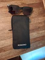 Komono zonnebril., Sieraden, Tassen en Uiterlijk, Zonnebrillen en Brillen | Dames, Ophalen of Verzenden, Zo goed als nieuw, Zwart