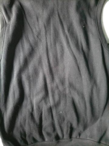 Zwarte bodywarmer.  Maat L.  beschikbaar voor biedingen