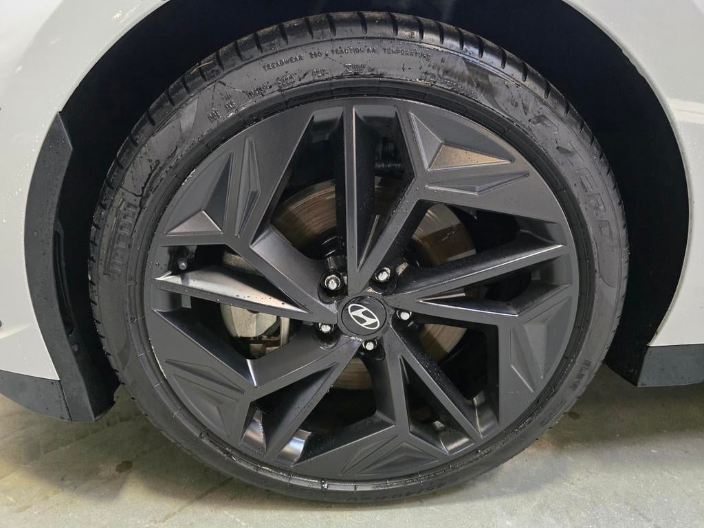 Hyundai IONIQ 6 First Edition AWD 77.4 kWh HUD Panorama 360, Auto's, Gebruikt, Zwart, Leder en Stof, Wit