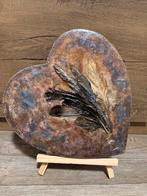 Hartvormig schilderij met veren, Verzenden