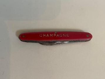 Vintage klein rood champagne zakmesje. Trouillard & Cie. beschikbaar voor biedingen