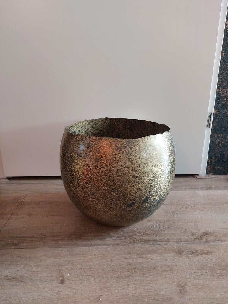 Gouden bloempot, Ophalen