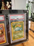 Pokémon PSA 7 1999 Charizard, Venusaur, Blastoise Set, Ophalen of Verzenden, Zo goed als nieuw, Meerdere kaarten, Foil