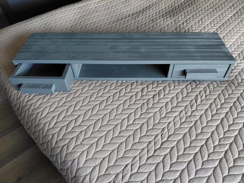 Woood Dennis wandplank, Ophalen