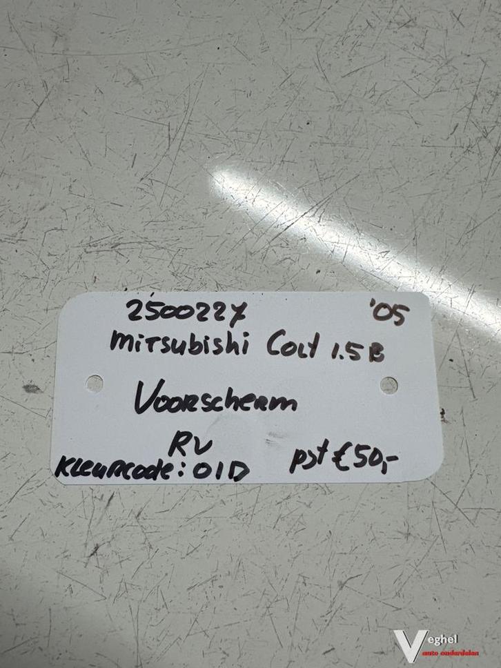 Mitsubishi Colt 1.5B kleurcode: 01D  2005 2500227 Voorscherm, Auto-onderdelen, Carrosserie en Plaatwerk, Spatbord, Gebruikt, Ophalen of Verzenden