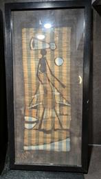 Batik schilderij, ingelijst, Waterdrager blauw, 53x26. 5B14