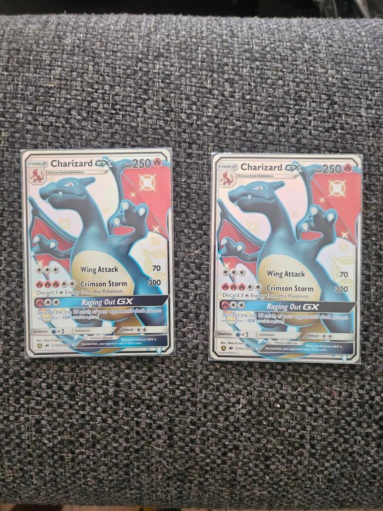Charizard pokemon kaart 2x, Ophalen of Verzenden, Zo goed als nieuw