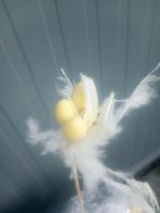 Steker met paaseitjes en veren, Ophalen